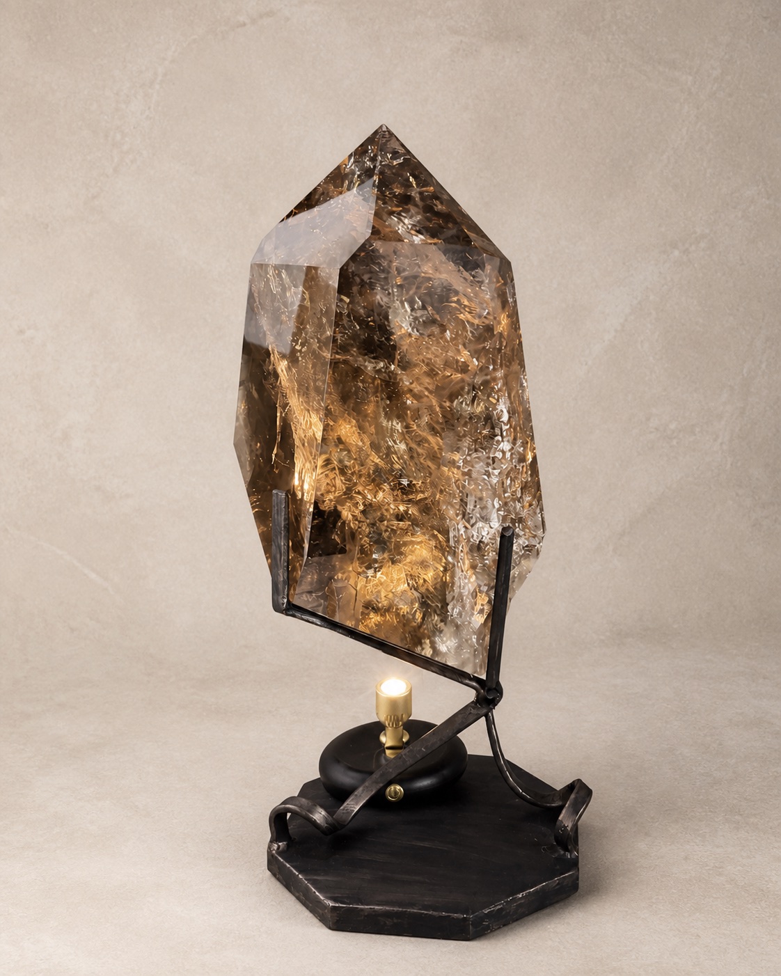 Front documentary view of the warm smoky quartz freeform sculpture