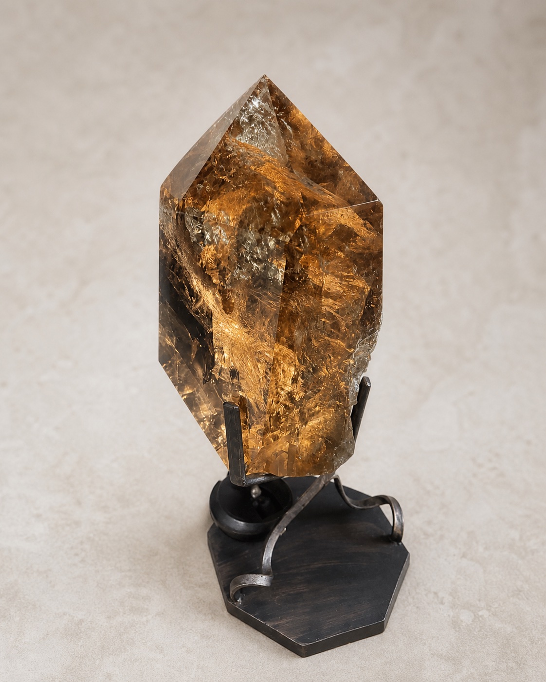 Alternate angle of the faceted warm smoky quartz sculpture