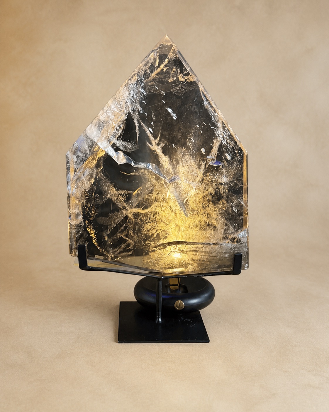 Front documentary view of the clear-to-smoky quartz shield point