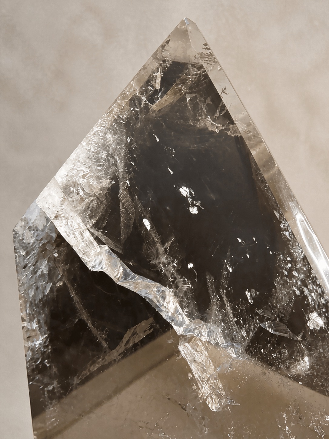 Close detail of the clear-to-smoky quartz surface and internal structure